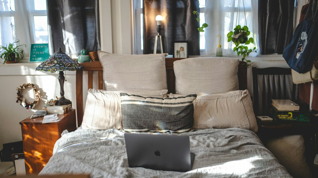 Person attending an online class on a laptop at home